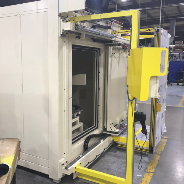 Industrial equipment with a large opening in a manufacturing facility.